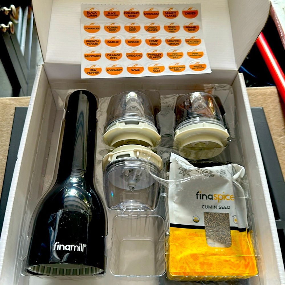 Finamil spice grinder. Batteries not included. Comes with 3 unopened spices.